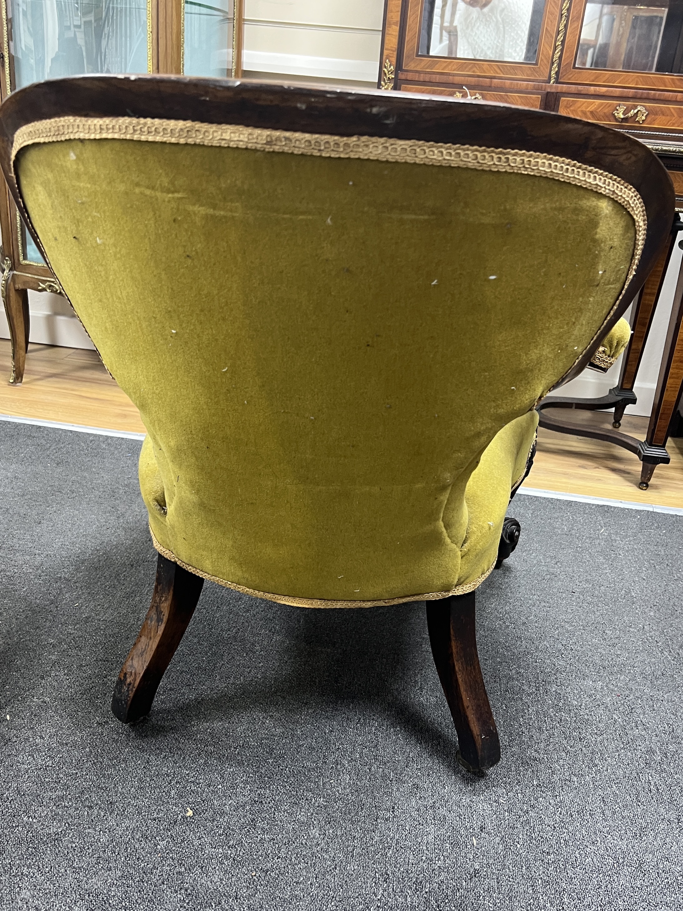 A Victorian rosewood upholstered open armchair, width 71cm, depth 72cm, height 79cm